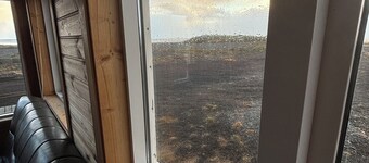 Black sand beachfront cabin with private hot tub