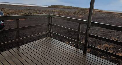 Black sand beachfront cabin with private hot tub