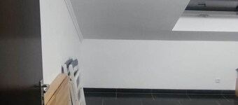 Small room with kitchenette and private bathroom.