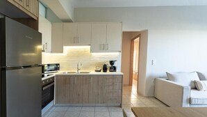 A modern kitchen with a central island, built-in appliances, and a minimalist design.