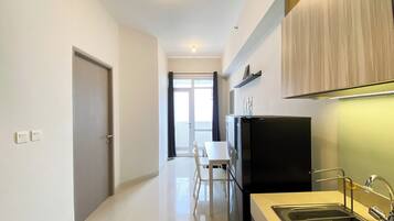 Apartment | Private kitchen | Fridge, stovetop, rice cooker, cookware/dishes/utensils