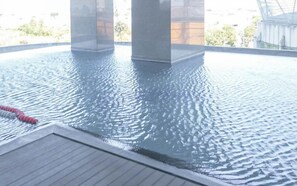 Outdoor pool - Homey And Simply 3Br At Grand Sungkono Lagoon Apartment (Surabaya)