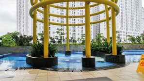 Outdoor pool - Cozy And Elegant Studio Apartment At Bassura City Near Mall (Jakarta)