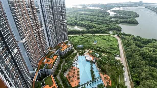 A high-rise building with a rooftop garden and a swimming pool. - Brand New And Homey Studio At Gold Coast Apartment Pik (Jakarta)