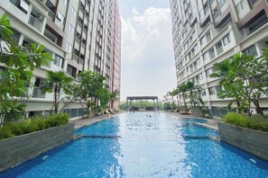 Outdoor pool - Good Choice and Comfy Studio Apartment at LRT City Jatibening (Bekasi)