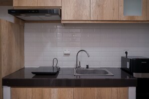 Standard Apartment | Private kitchen - Comfy Designed Studio Apartment At Anwa Residence (South Tangerang)