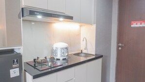 Standard Apartment | Private kitchen - Comfortable Design Studio Room At Transpark Juanda Bekasi Timur Apartment (Bekasi)
