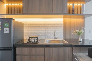 Apartment | Private kitchen - Cozy And Modern Look 1Br Apartment Vasanta Innopark By Travelio (Cikarang)