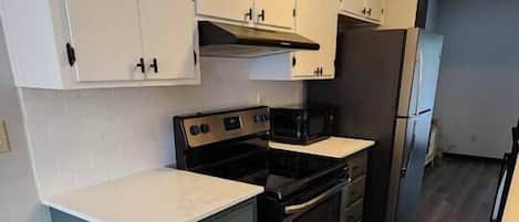 Coffee/tea maker, fridge, microwave, oven