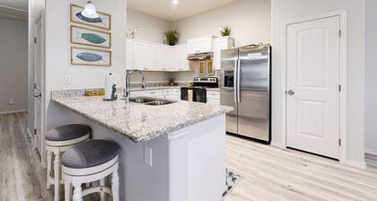 Stunning beach house with balcony and fenced in private pool - steps to sand