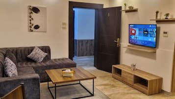 Apartment, 2 Bedrooms, Accessible, Smoking | Living room | Flat-screen TV
