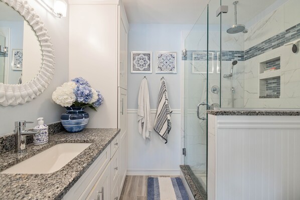 Shower, hair dryer, towels, toilet paper