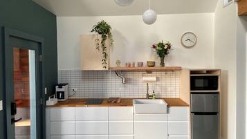 Fridge, microwave, stovetop, coffee/tea maker