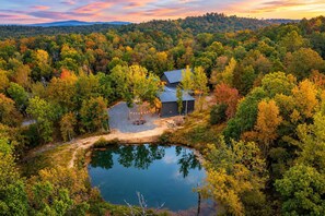 A few steps from the cabin, your private stocked pond awaits — peaceful mornings, fishing poles, and reflection guaranteed. - Private Pond & Loaded Game Rm, 2 acres | Sleeps 20 (Broken Bow)