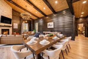Gather around the 10-seat dining table or chat at the island — no one misses the fun. - Private Pond & Loaded Game Rm, 2 acres | Sleeps 20 (Broken Bow)