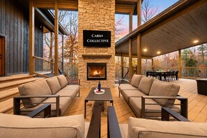 The covered patio connects the main house and casitas — creating one seamless outdoor gathering space. - Private Pond & Loaded Game Rm, 2 acres | Sleeps 20 (Broken Bow)