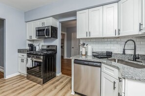 Fridge, microwave, oven, stovetop - Forest Hills 3BR Home w/ Parking + Keypad Entry | Sleeps 7 (Pittsburgh)