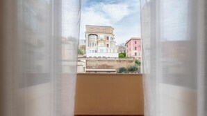 A balcony with a view of buildings. - My Rooms in Vatican City (Rome)