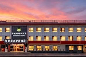 A hotel with a modern facade, multiple windows, and a prominent sign. - GreenTree Inn Express Hotel (Beijing Fangshan District Government Longhu Tianjie) (Beijing)