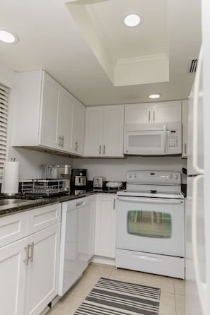 Fridge, microwave, oven, stovetop - Coastal Cottage House in Naples Park, Walking Distance to the Beach (Naples)