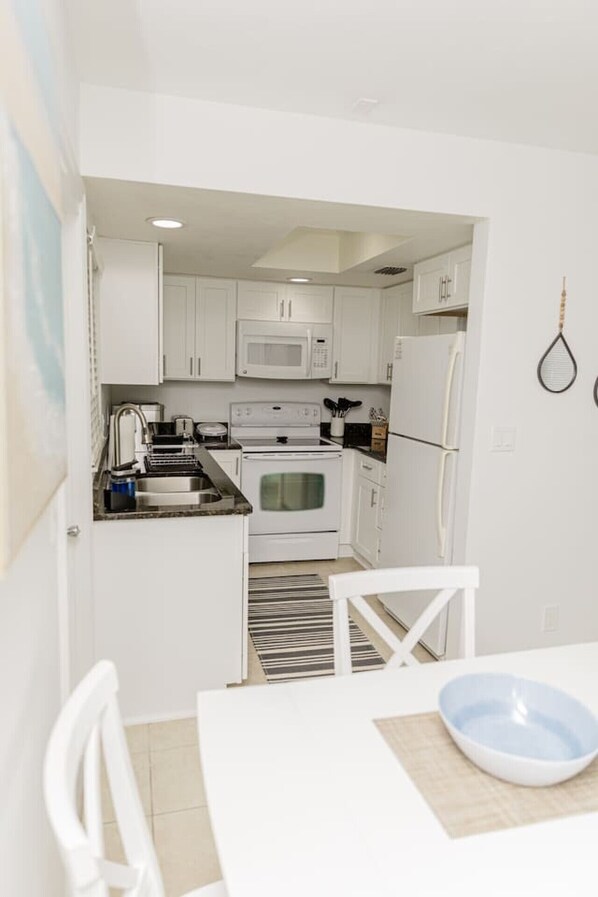Fridge, microwave, oven, stovetop - Coastal Cottage House in Naples Park, Walking Distance to the Beach (Naples)