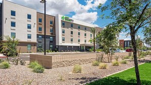 A modern hotel with a flat facade, multiple windows, and a sign indicating it is a Staybridge Inn. - Extended Stay America Premier Suites – Phoenix - Chandler – Airport (Chandler)