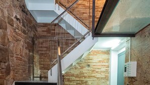 A staircase with metal railings leading to a lower level. - Jaume Atico 509 - Studio Apartment, Sleeps 2 (Barcelona)