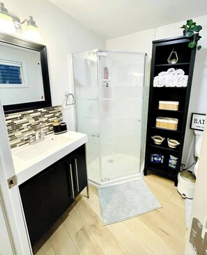 Shower, hair dryer, towels, soap