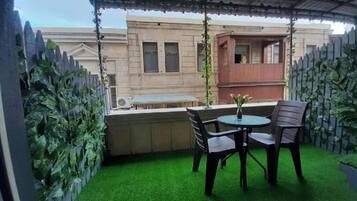 Junior Suite, City View | Terrace/patio