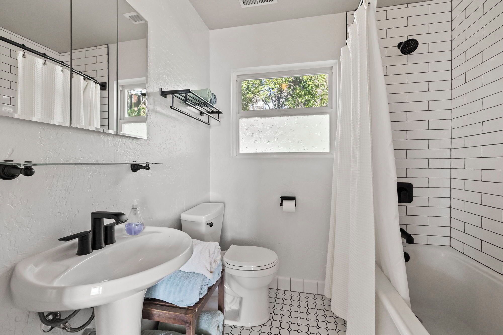 Shower, towels, soap, toilet paper