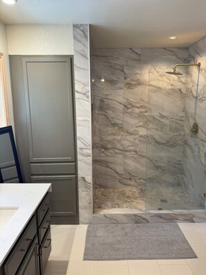 Shower, towels, soap, toilet paper