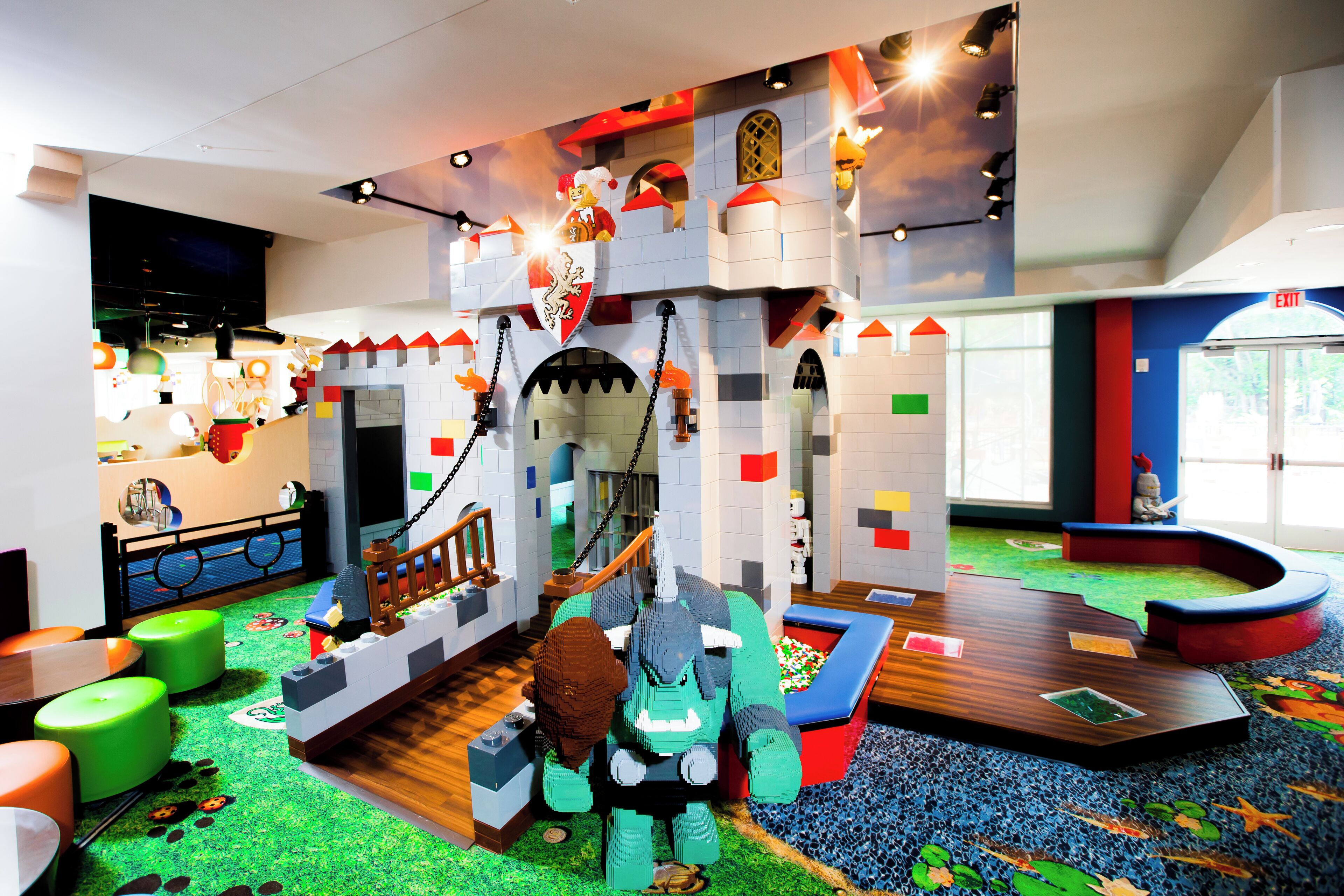 A play area with a castle, a slide, and a ball pit.