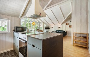 Fridge, stovetop, dishwasher, coffee/tea maker