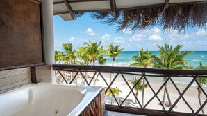 A balcony with a view of the beach, a hot tub, and palm trees. - Mia Tulum Beachfront Resort - Ocean View Suites and Beach Club (Tulum)