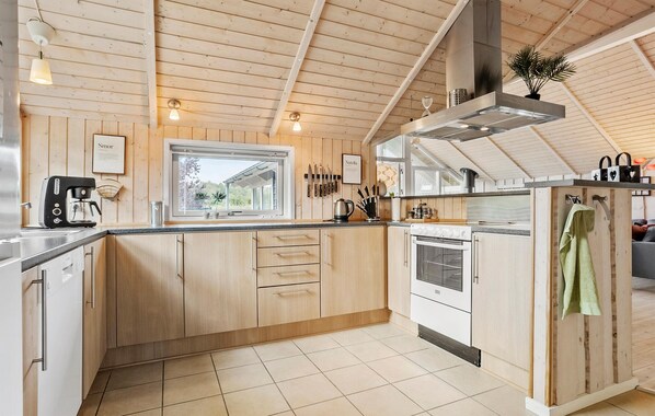 Fridge, stovetop, dishwasher, coffee/tea maker