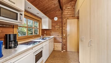 Fridge, stovetop, dishwasher, coffee/tea maker