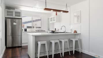 Fridge, dishwasher, coffee/tea maker, cookware/dishes/utensils