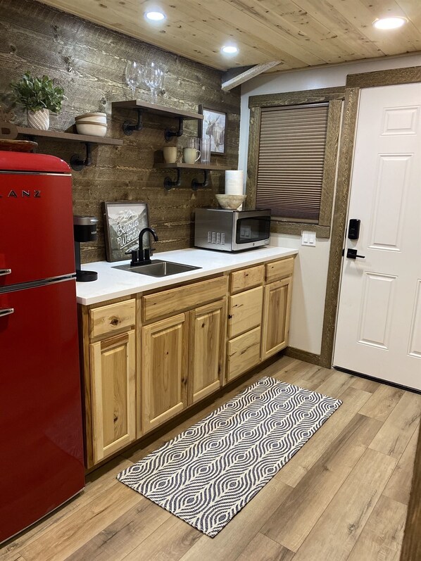 Fridge, microwave, coffee/tea maker, toaster