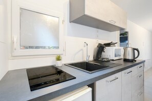 Microwave, stovetop, coffee/tea maker, electric kettle