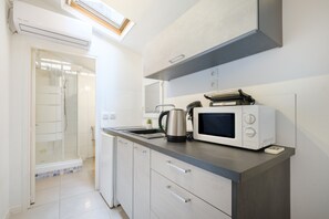 Microwave, stovetop, coffee/tea maker, electric kettle