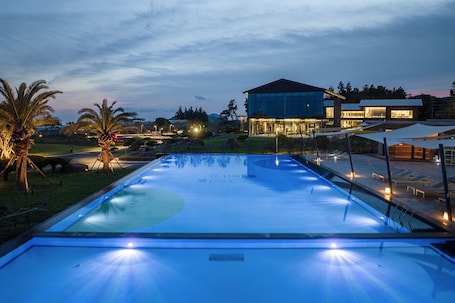 Seasonal outdoor pool, open 9:00 AM to 9:00 PM, pool umbrellas