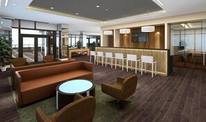 A modern lobby with a reception desk, seating area, and a large window offering a view. - Stunning One Bedroom with Luxury Amenitites (Boston)
