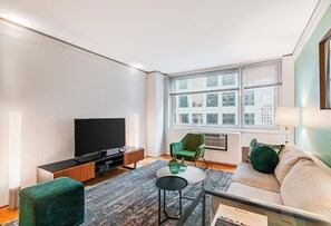 TV - Comfortable, Spacious Midtown West One Bedroom, near Central Park Entrance [1] (New York)