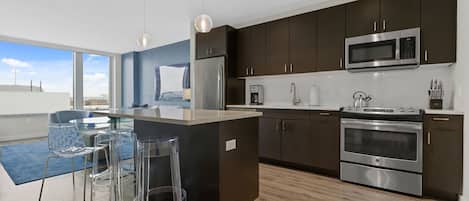 Coffee/tea maker, fridge, microwave, oven