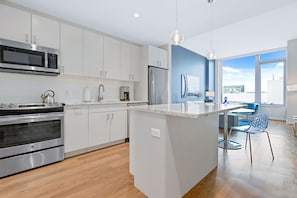 Fridge, microwave, oven, stovetop - One Bedroom in Luxury Seaport Apartment Building (Boston)