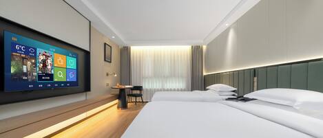 A modern hotel room with a large bed, a flat-screen TV mounted on the wall, a small table, and a chair.