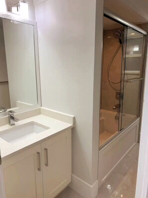 Shower, towels, soap, toilet paper