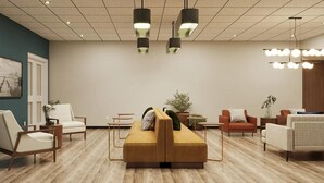 A modern lobby with a sofa, chairs, and a coffee table. - The Bridges Hotel  (Natchez)