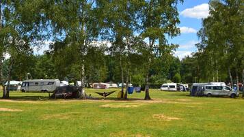 A campsite with RVs and tents.