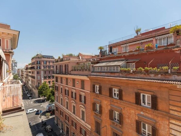 A multi-story building with a classic architectural style, featuring balconies and windows.